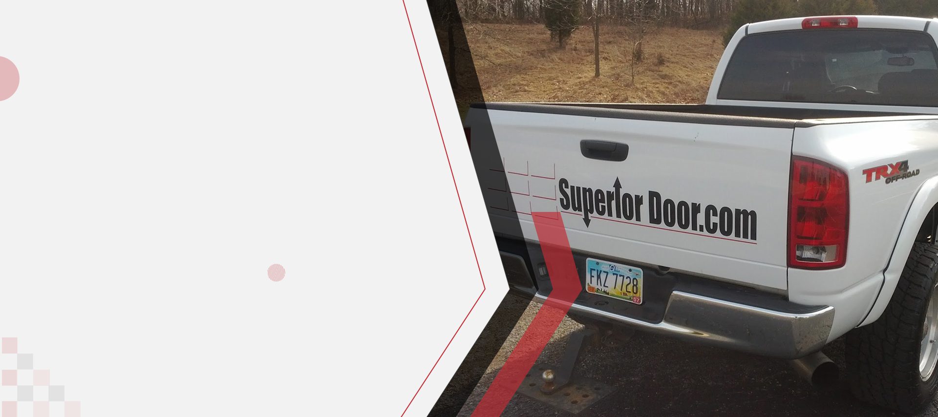 A vehicle with the words 'Superior Door' on its side, parked outdoors.